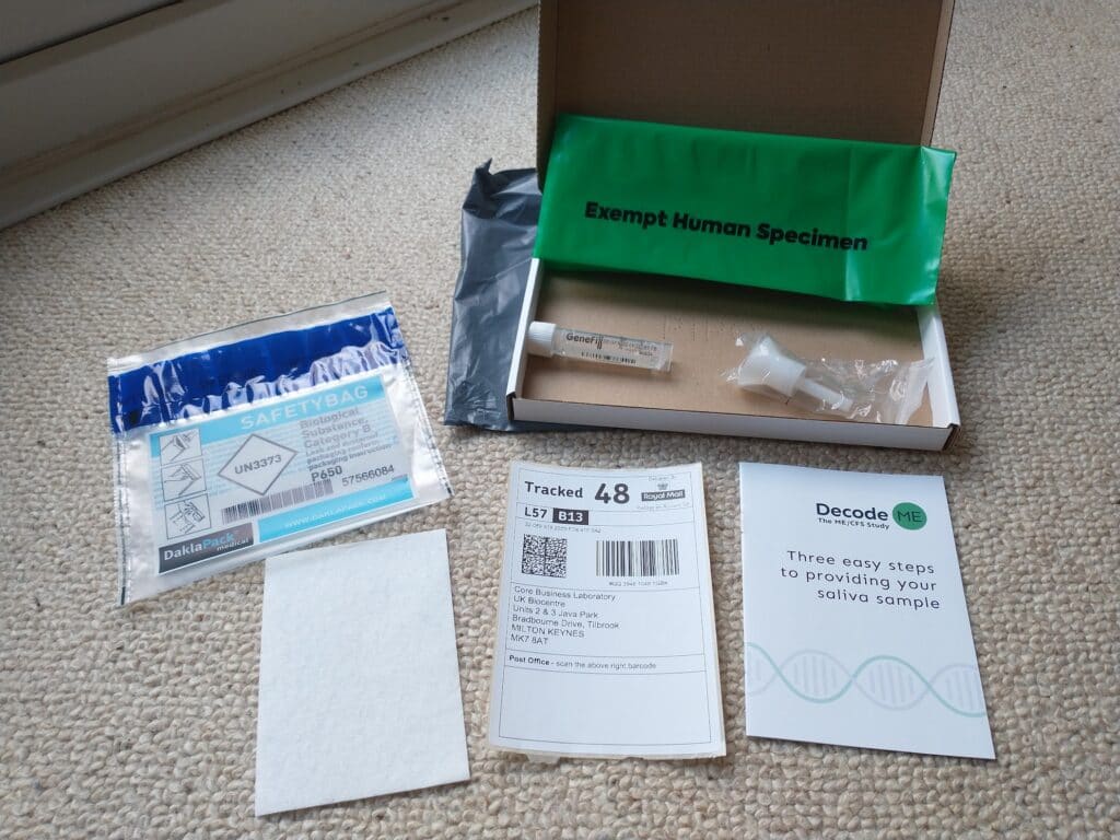 Spit kit with open boxed to show contents like funnel, plastic tube and bags.